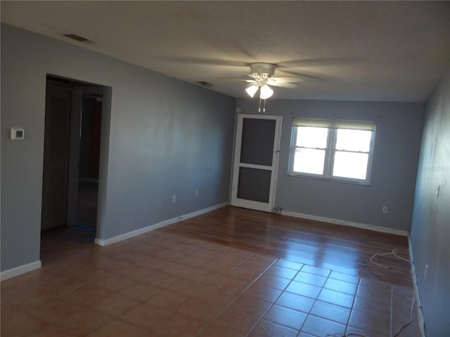 spare room with wood-type flooring, a textured ceiling, and ceiling fan