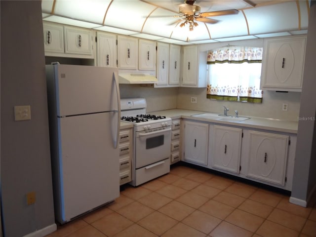 kitchen with white appliances, ceiling fan, sink, white cabinets, and light tile patterned flooring