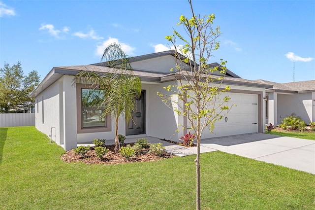 view of front facade featuring a garage and a front lawn