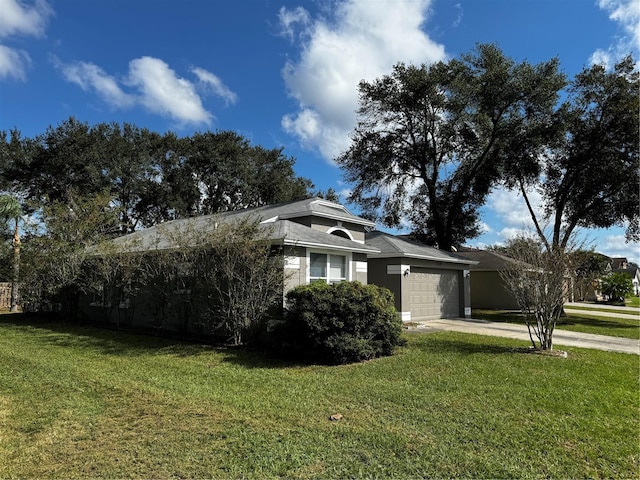 view of front of home with a garage and a front yard