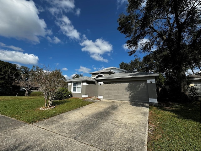 view of front facade featuring a front yard and a garage