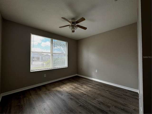 unfurnished room with ceiling fan, a textured ceiling, and dark hardwood / wood-style floors