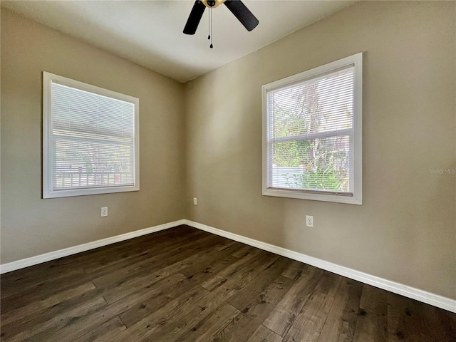 unfurnished room featuring dark hardwood / wood-style flooring and ceiling fan