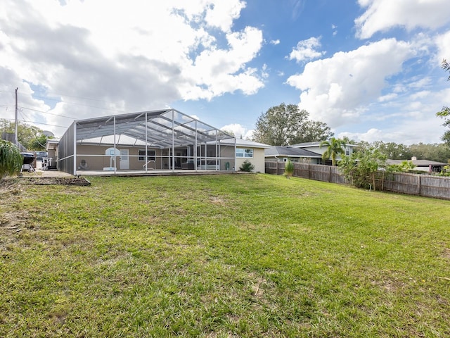 view of yard with a lanai