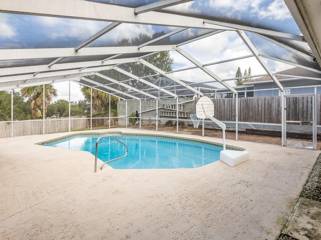 view of pool with a patio area and a lanai