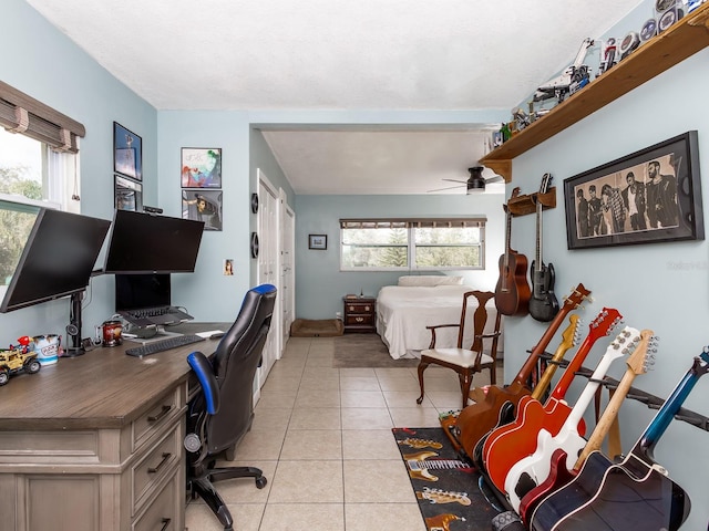 home office with ceiling fan and light tile patterned flooring