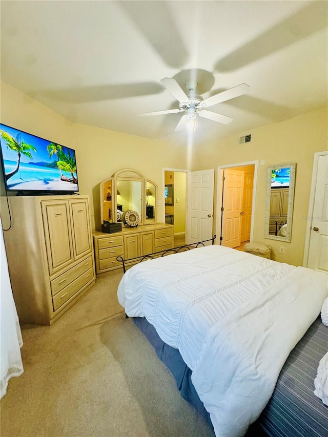 bedroom featuring ceiling fan and light colored carpet