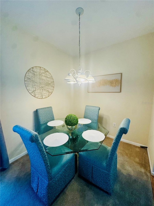 carpeted dining room featuring an inviting chandelier