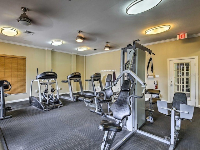 exercise room with ceiling fan and ornamental molding