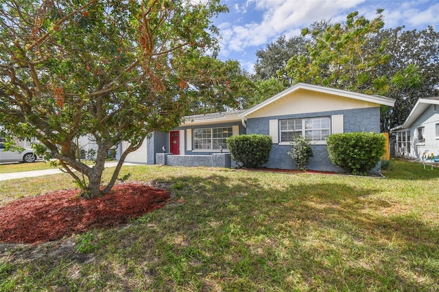 ranch-style home with a front lawn, central air condition unit, and a garage