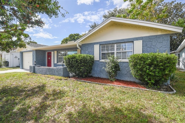 single story home with a garage and a front yard