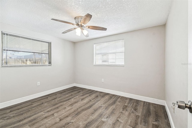 unfurnished room featuring ceiling fan, a textured ceiling, and dark hardwood / wood-style floors