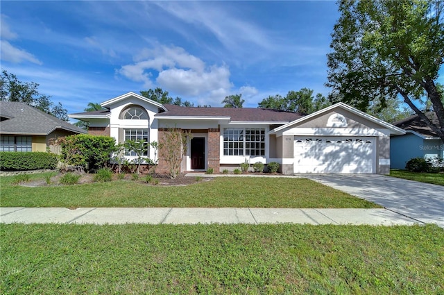 single story home featuring a garage and a front lawn