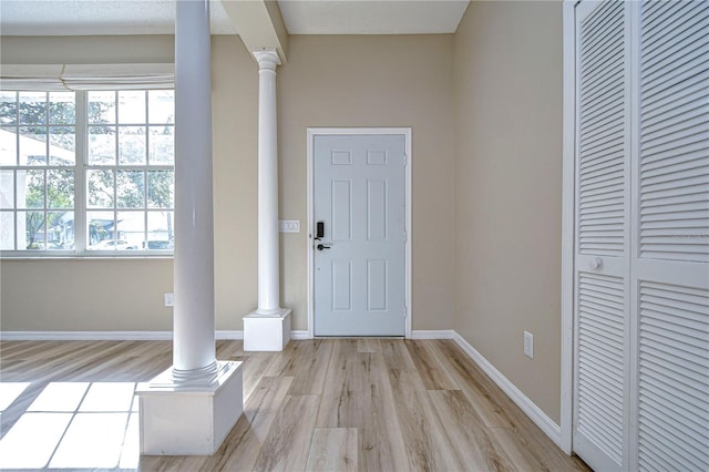 foyer entrance with light hardwood / wood-style flooring