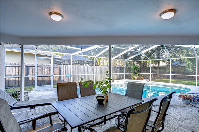 view of patio / terrace with a lanai and a fenced in pool