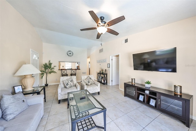 tiled living room featuring vaulted ceiling and ceiling fan