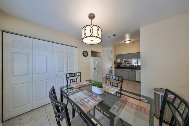 dining space with light tile patterned flooring