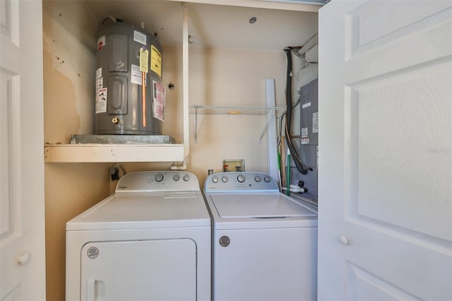 washroom featuring electric water heater and washing machine and clothes dryer