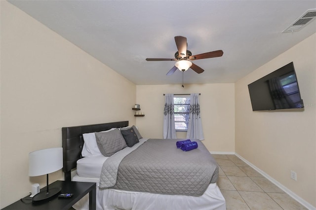 tiled bedroom with ceiling fan