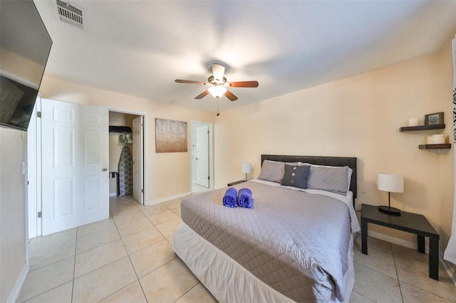 bedroom with light tile patterned flooring and ceiling fan