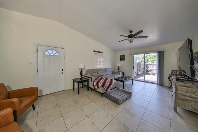 living room with light tile patterned flooring, ceiling fan, and vaulted ceiling