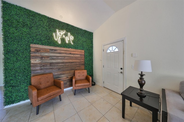 tiled entryway with vaulted ceiling