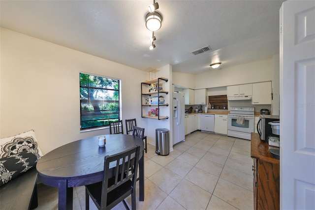 dining room featuring light tile patterned floors