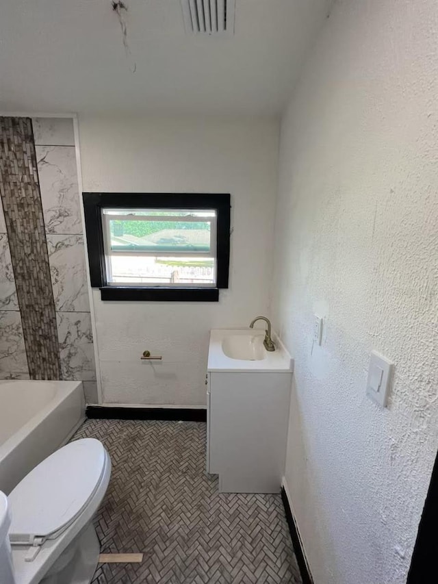 bathroom with vanity and toilet