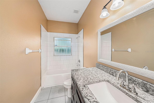 full bathroom with toilet, vanity, tiled shower / bath, and tile patterned floors