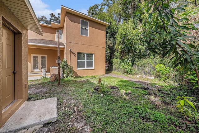 view of yard featuring french doors