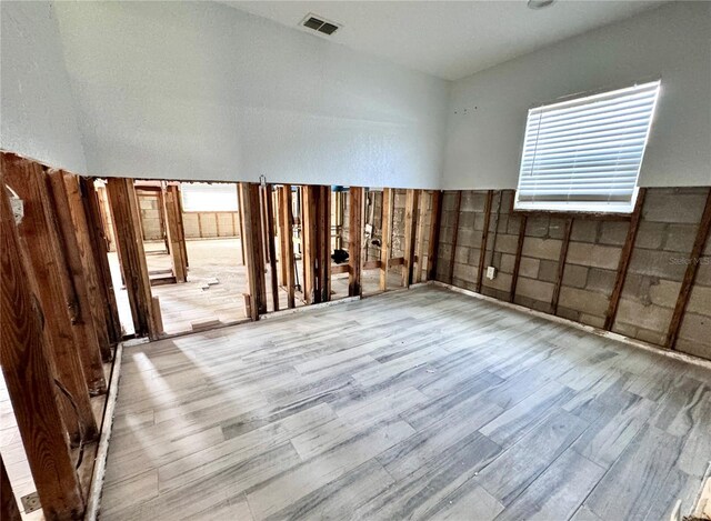 spare room with light hardwood / wood-style flooring