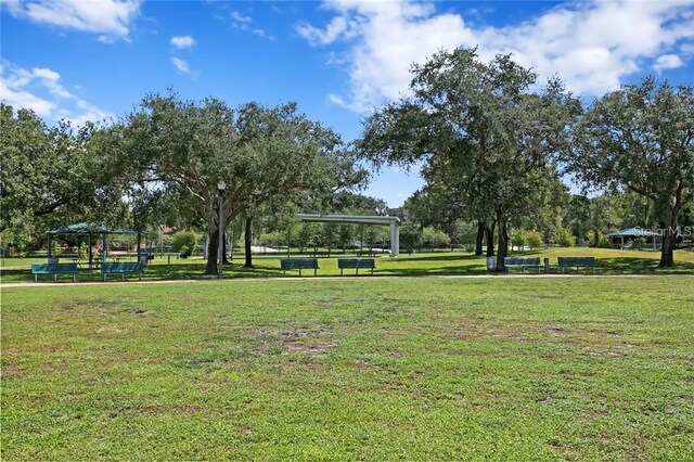 surrounding community with a lawn and a gazebo