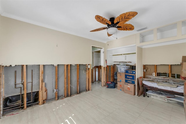 bedroom with a ceiling fan, visible vents, and crown molding