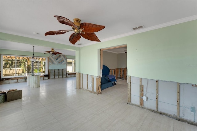 empty room featuring ornamental molding and visible vents