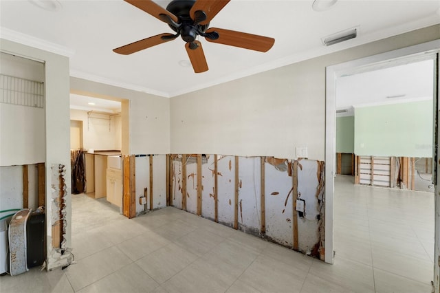 spare room with visible vents and crown molding