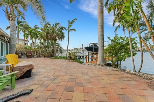 view of patio / terrace with a dock and boat lift