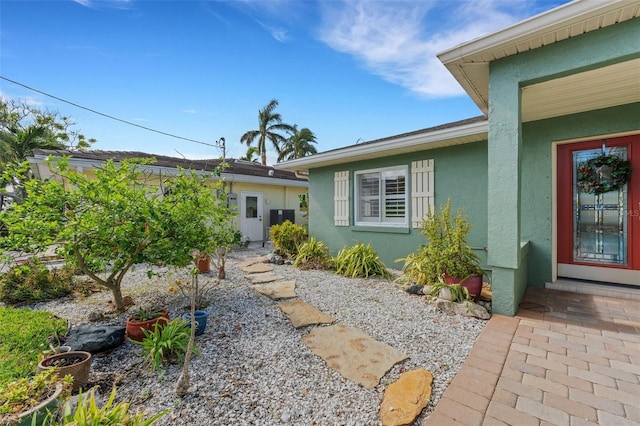 exterior space featuring stucco siding