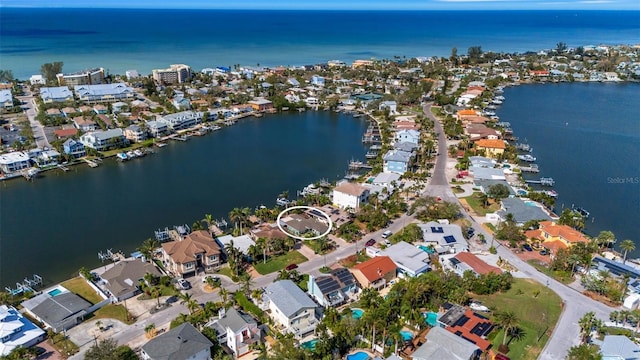 drone / aerial view featuring a water view and a residential view