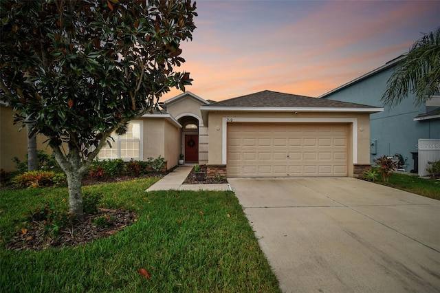 single story home featuring a garage