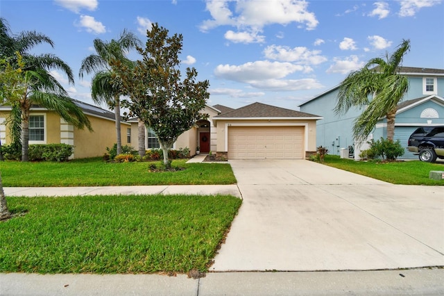 ranch-style home featuring a garage and a front lawn