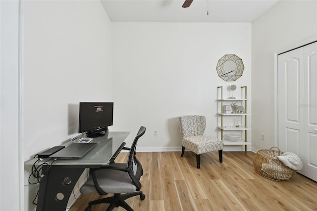 home office with wood-type flooring and ceiling fan