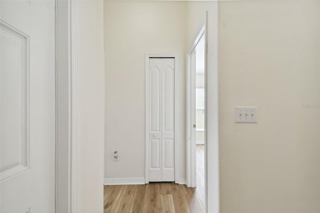 corridor featuring light hardwood / wood-style floors