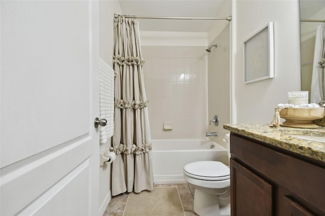 full bathroom featuring toilet, shower / bath combo, vanity, and tile patterned flooring