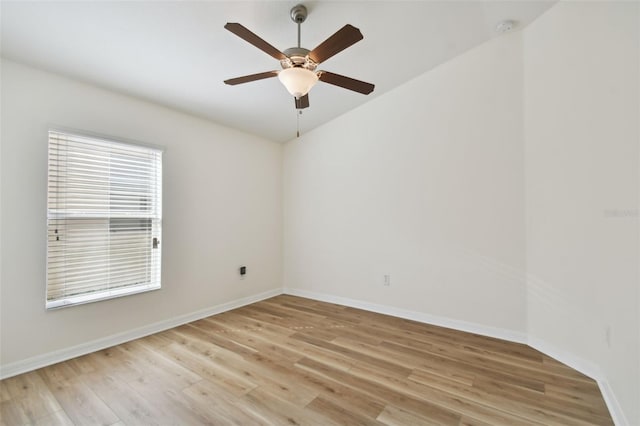 spare room featuring light hardwood / wood-style flooring and ceiling fan