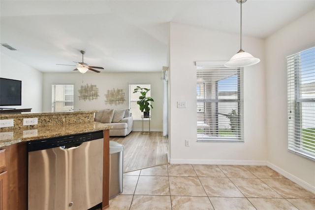 kitchen with dishwasher, ceiling fan, light tile patterned flooring, light stone countertops, and pendant lighting