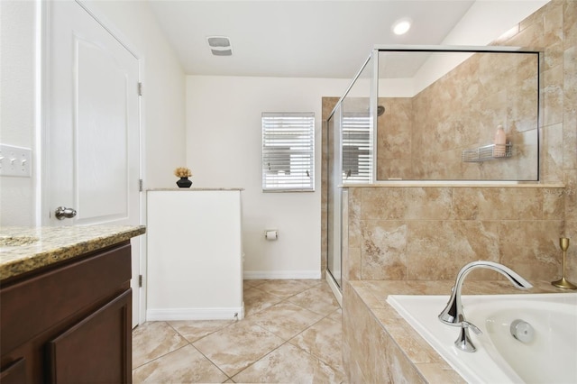 bathroom featuring tile patterned flooring, vanity, and separate shower and tub