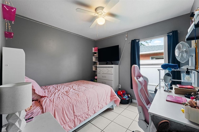 tiled bedroom with ceiling fan