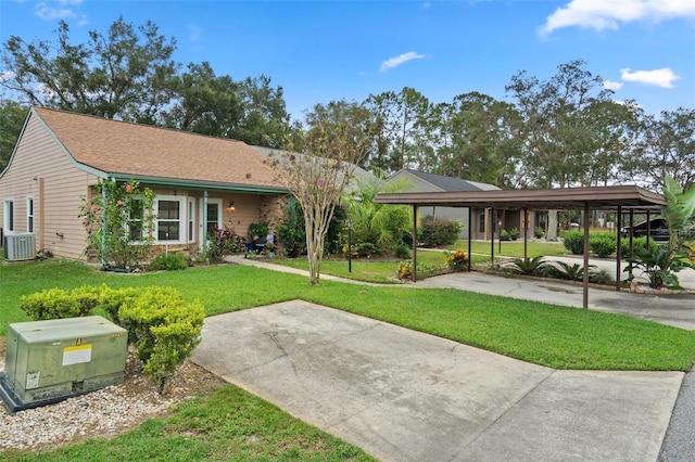 ranch-style house featuring cooling unit, a front lawn, and a carport