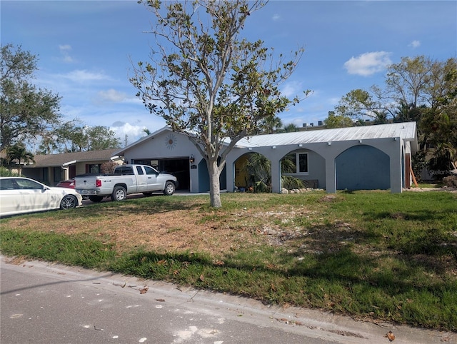 single story home featuring a carport