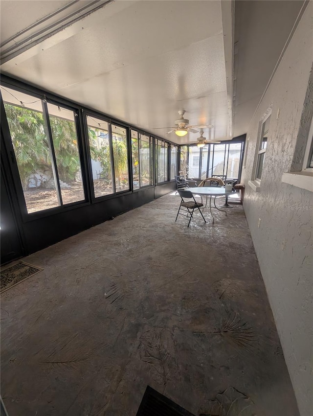 unfurnished sunroom featuring plenty of natural light